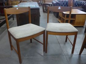 A pair of McIntosh teak side chairs