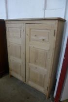 A Victorian pine two door housekeeper's cupboard