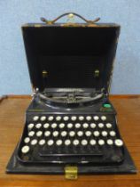 A vintage cased Remington Home Portable typewriter
