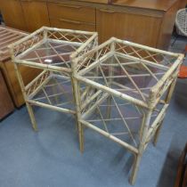 A pair of glass topped two tier bamboo plant stands