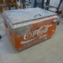 A vintage metal insulated Coca-Cola drinks cooler, with bottle opener