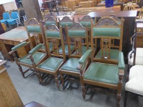 A set of eight Arts and Crafts oak dining chairs