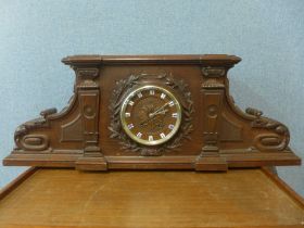 A 19th Century French carved architectural cased oak mantel clock