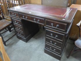 A mahogany pedestal desk