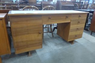 A Formica topped afromosia desk