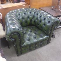 A green leather Chesterfield armchair