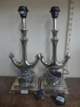 A pair of chrome anchor shaped table lamps