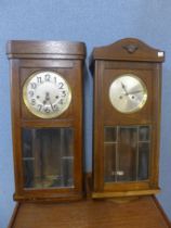 Two oak wall clocks