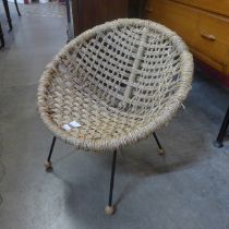 A Danish child's black metal and cord ball chair
