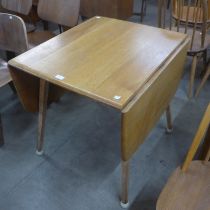 An Ercol Blonde and beech Windsor drop-leaf table