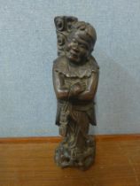 An oriental carved hardwood figure of a sage