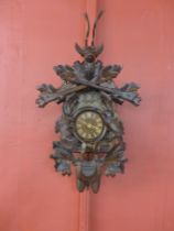 A Black Forest carved wood cuckoo clock