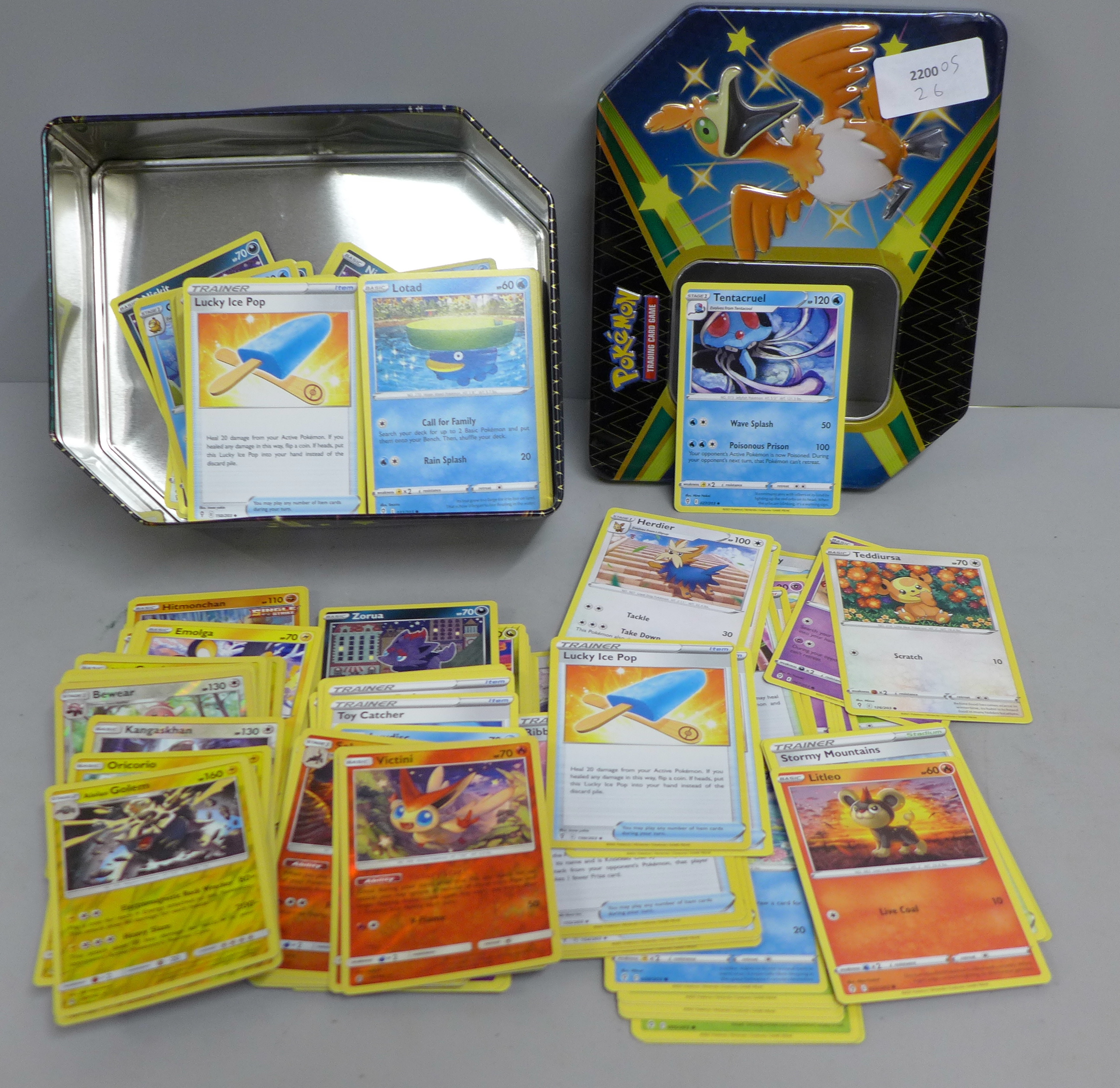 Over 400 Pokemon cards in tin with shiny cards