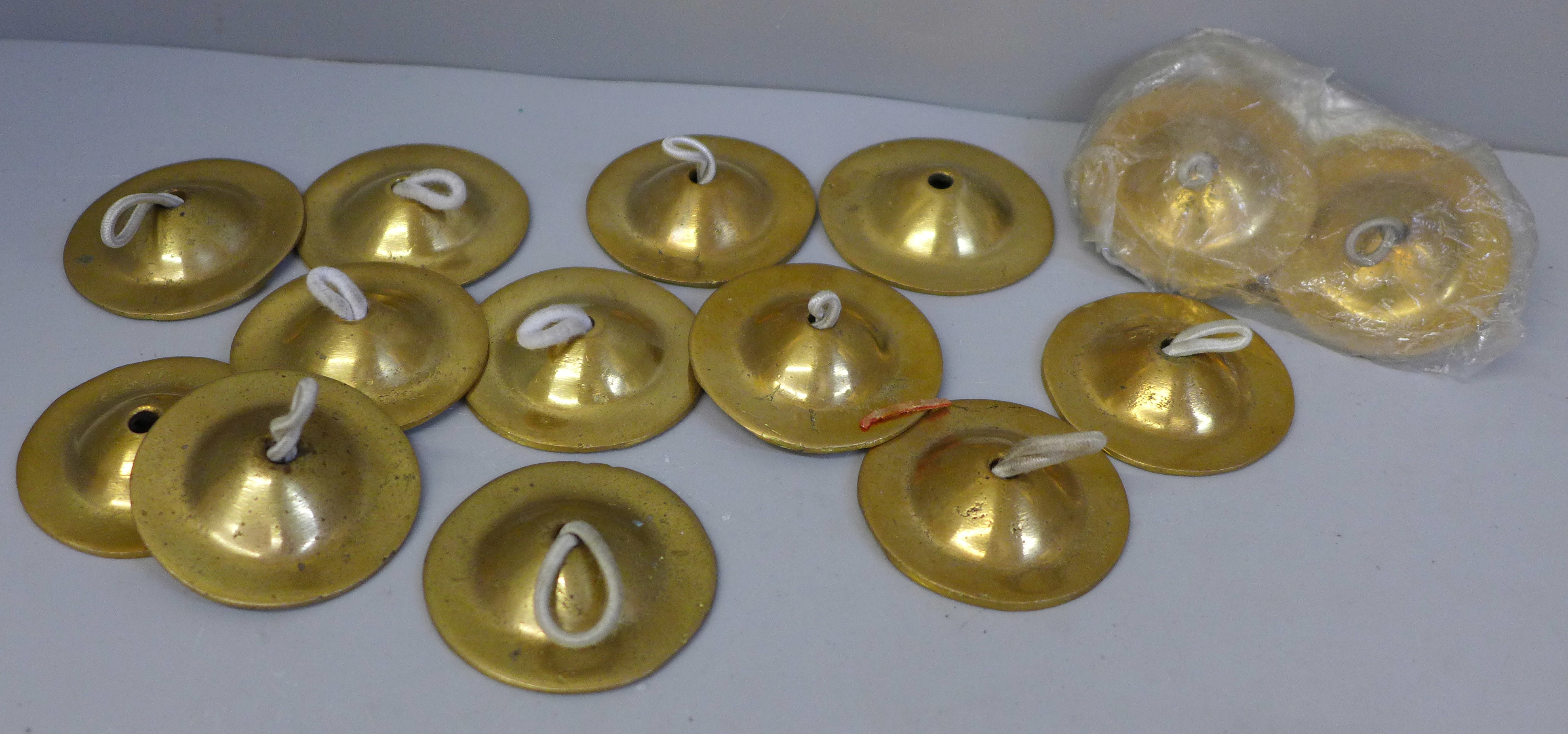 Eight pairs of brass finger cymbals for belly dancing