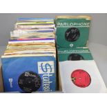 A box of 45 rpm vinyl records, mainly 1960s including The Beatles, Four Seasons, Del Shannon, etc.
