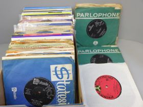 A box of 45 rpm vinyl records, mainly 1960s including The Beatles, Four Seasons, Del Shannon, etc.