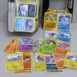 Over 400 Pokemon cards in tin with shiny cards