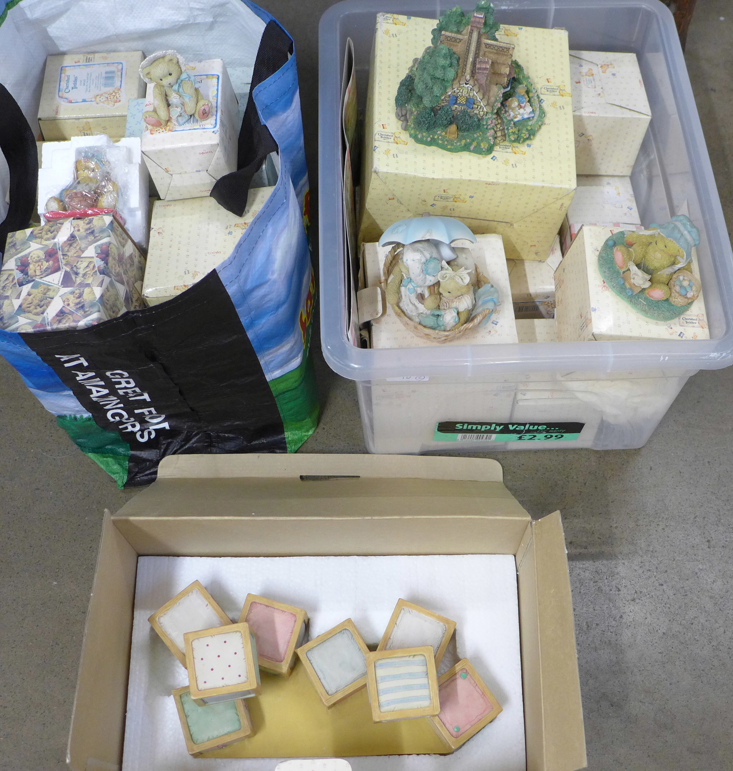 A large collection of Cherished Teddies figures, approximately 33, boxed and a nursery display stand