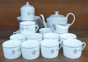A Limoges Chandon Gris platinum edged hand painted coffee set, twelve cups, saucers, a cream jug,
