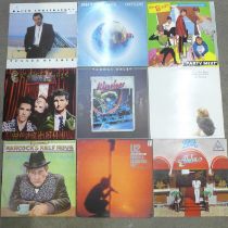 Eighteen LP records including Bruce Springsteen, B52s and The Associates