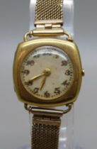 A lady's 18ct gold cushion case wristwatch on a 9ct gold mesh strap, total weight 23.6g (approximate