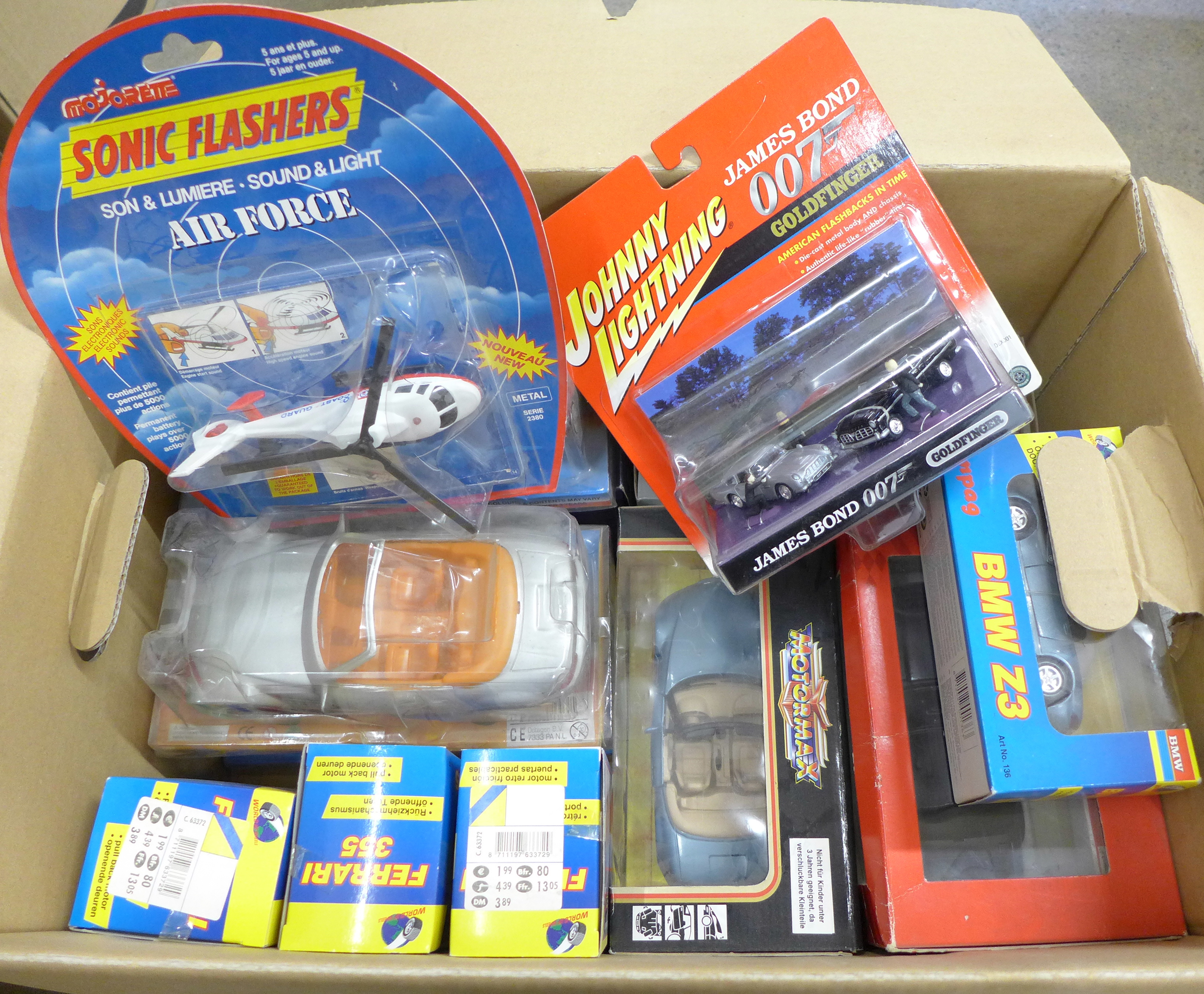 A collection of model sports cars, boxed