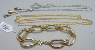 Two silver necklaces - a 32 inch gilt Figaro chain and an 18 inch three tone Midas necklace,