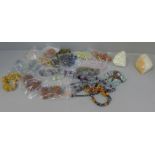 A collection of gemstone bracelets and two crystal geodes