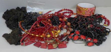 A collection of black and red costume jewellery