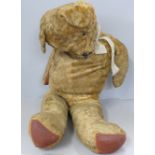 A large plush jointed straw filled vintage Teddy bear, a/f
