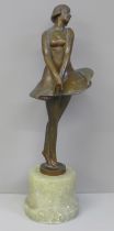 An early 20th Century Art Deco bronzed metal figure of a ballerina on an onyx base, restored, 30.5cm