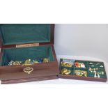 A jewellery box containing gold tone costume jewellery including a pair of Monet earrings, box