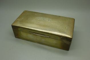 A silver cigarette box, engraved initials to the lid, cedar lined, Sheffield 1931