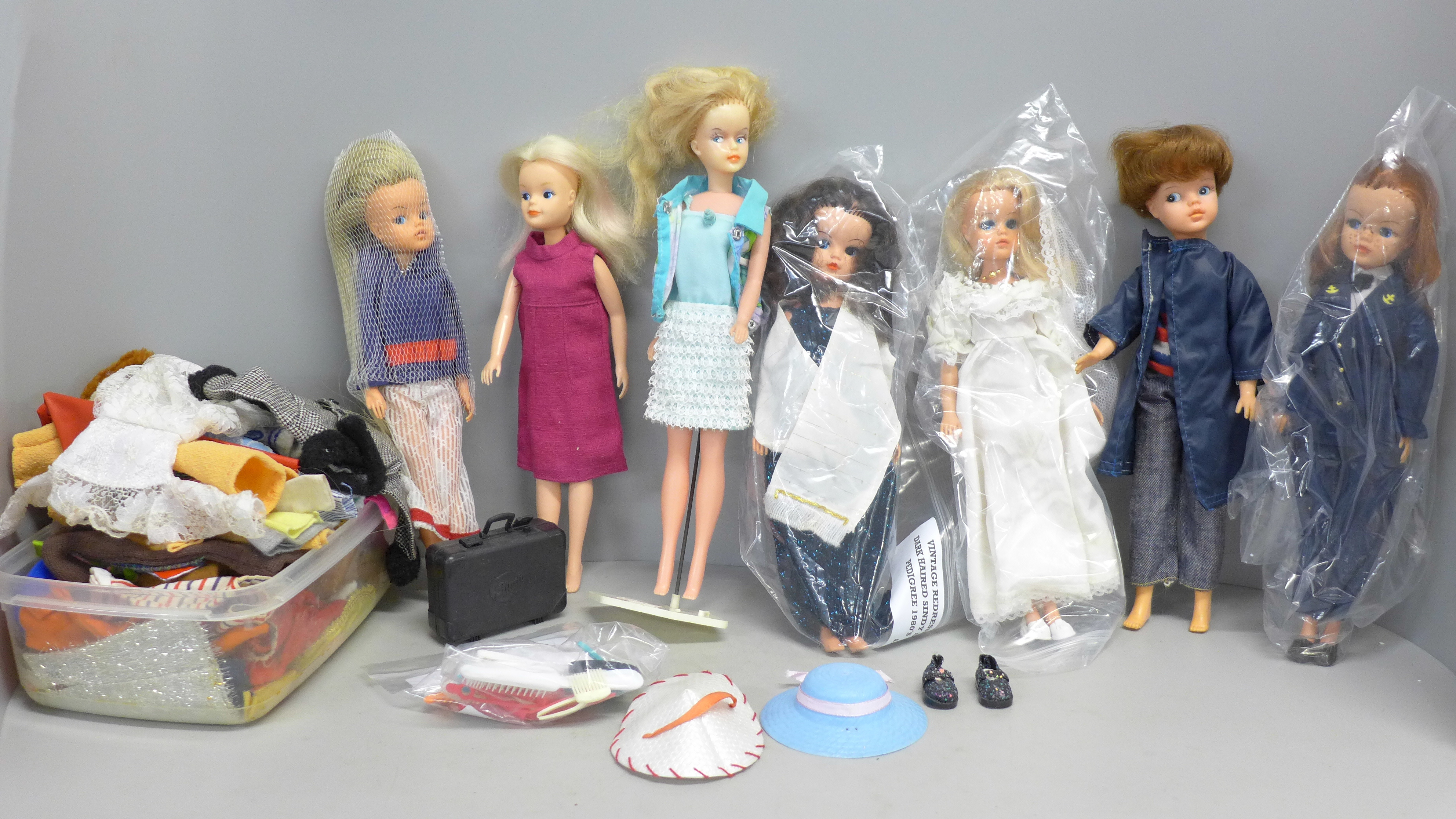 A box of Sindy dolls and clothing
