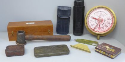 A box of assorted items; brass clock, gauges, cigar cases