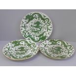 Three Chinese green dragon plates, all a/f (hairline cracks, crazed and chip to rim), 21cm