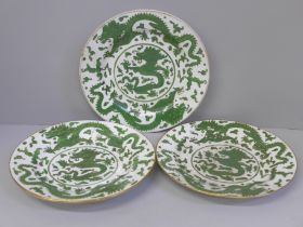 Three Chinese green dragon plates, all a/f (hairline cracks, crazed and chip to rim), 21cm