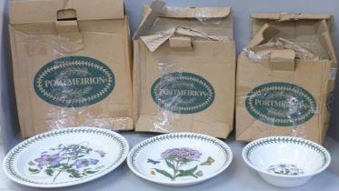 A collection of Portmeirion Botanic Garden; four bowls, four side plates and four larger plates,