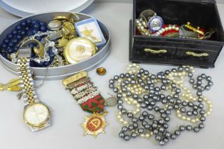 Two boxes of costume jewellery, badges and medallions