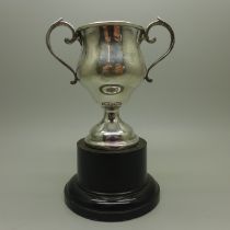 A two handled silver trophy on stand, London 1937