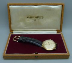 A Longines 18ct gold wristwatch, 35mm case including crown, with presentation inscription to case