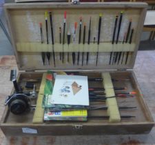 A collection of fishing related items, Garcia Mitchell 204 reel, floats, weights, etc.