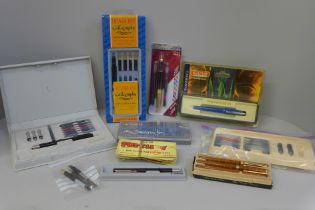 A box of calligraphy pen sets, a Waterman ballpoint pen, Yafa fountain pen, etc.