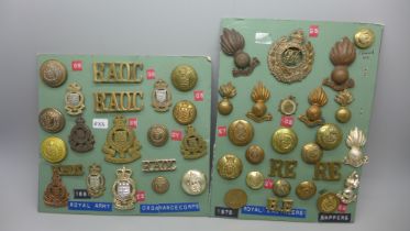 A collection of Royal Engineers and Army Ordnance Corps cap badges and insignia