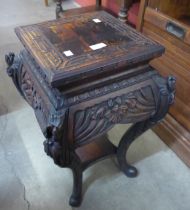 A Chinese carved wood jardiniere stand