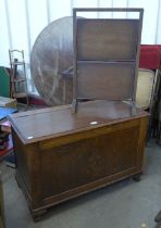 A carved oak blanket box and a folding cakestand