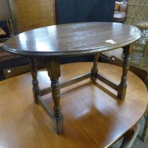 An oval oak coffee table