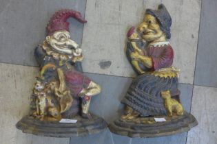 A pair of painted cast iron Punch and Judy door stops