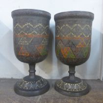 A pair of Eastern enamelled brass vases