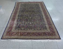 An Eastern beige ground rug, 158 x 260cms